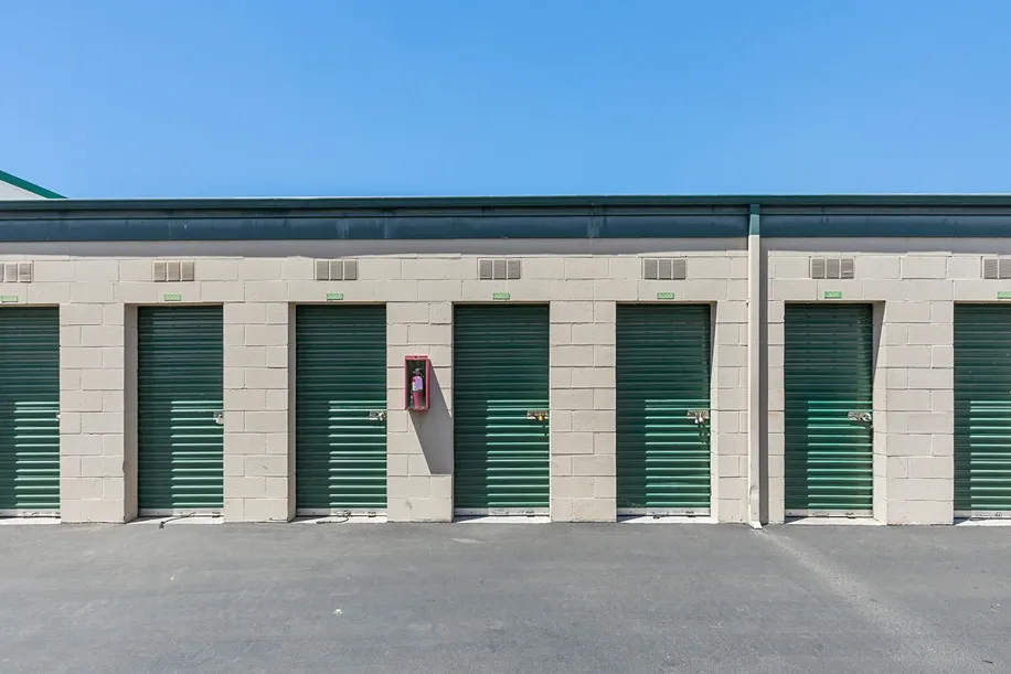 Outdoor storage lockers with paved road.
