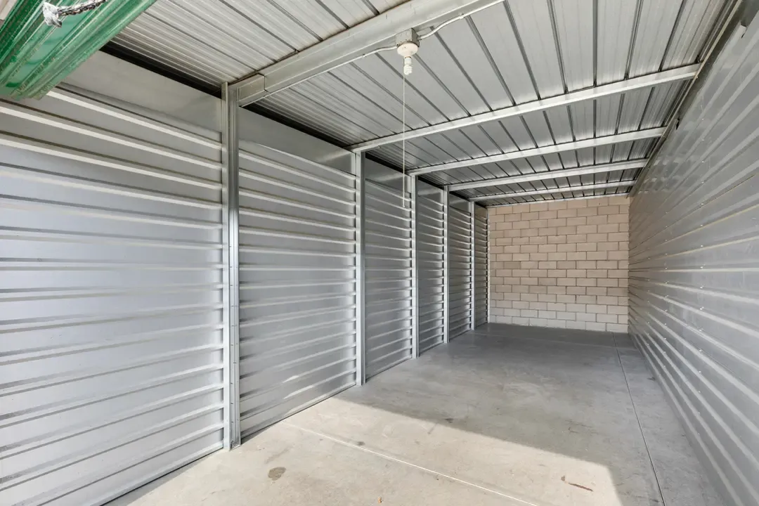 Interior of a storage concrete & metal walled storage unit.