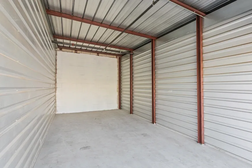 Interior of a white walled storage unit.