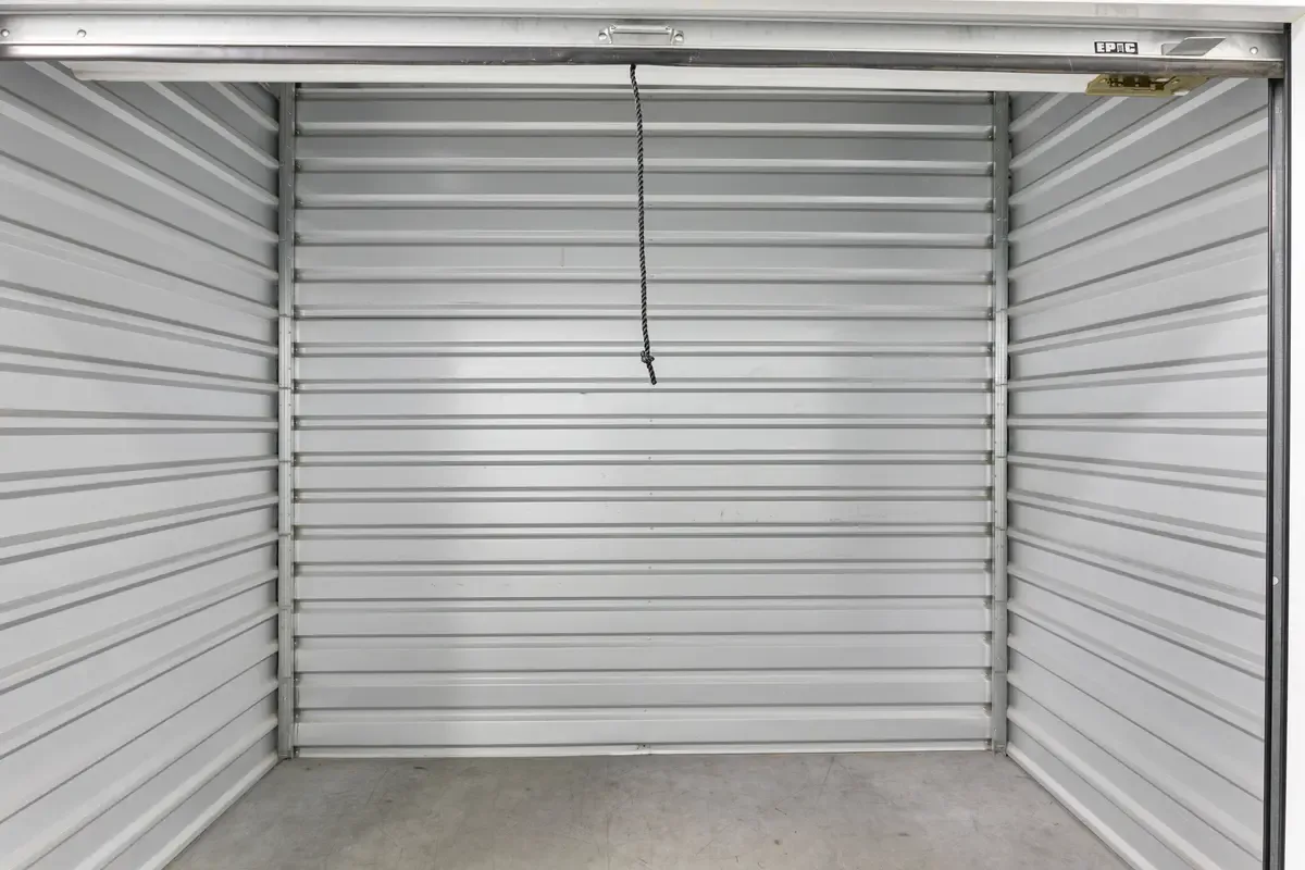 Interior of a small white walled storage unit.