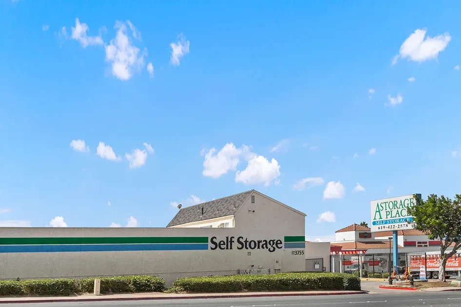 A building marked self storage with a large self storage road sign.