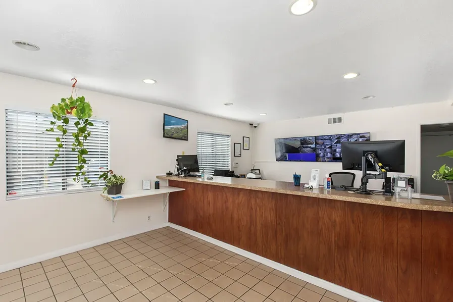 Interior storage facility office with a wood desk.
