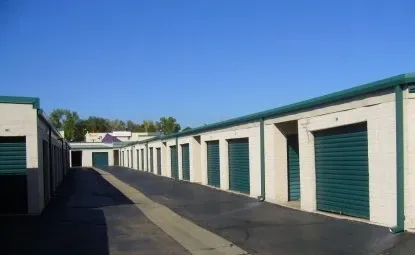 Black road near outdoor storage units.