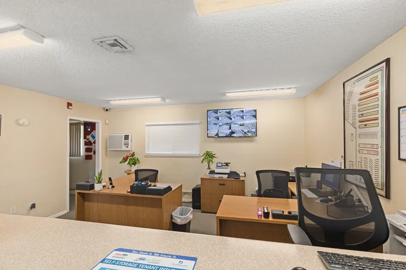 Multiple desks at a storage facility office.