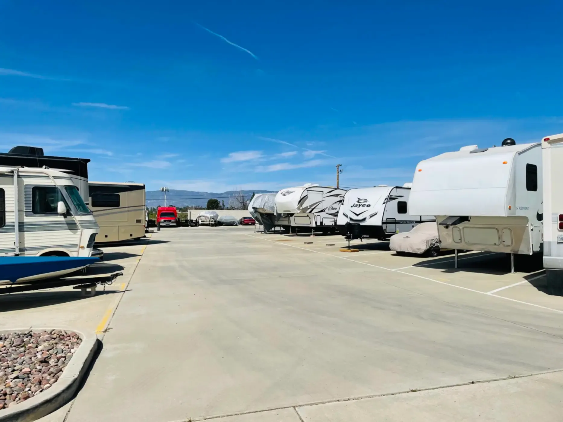 Campers parked in RV storage spaces.